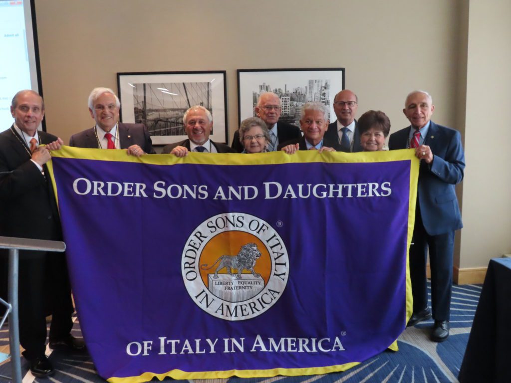 Group of people holding flag of there organization