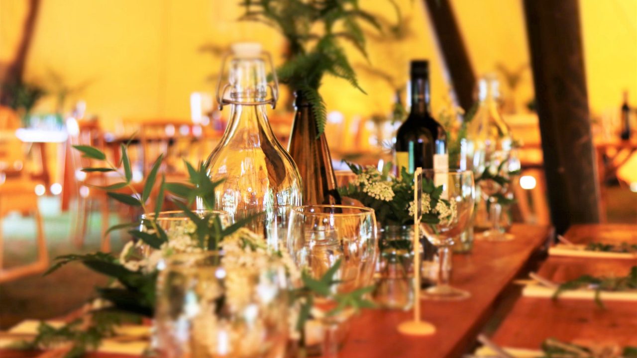 Wine Glasses and Wine Bottles on Top of Brown Wooden Table